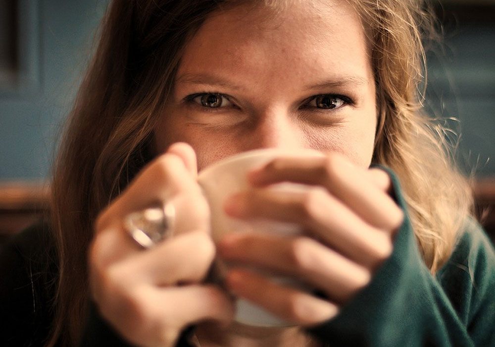 Smiling Woman With Coffee Cup