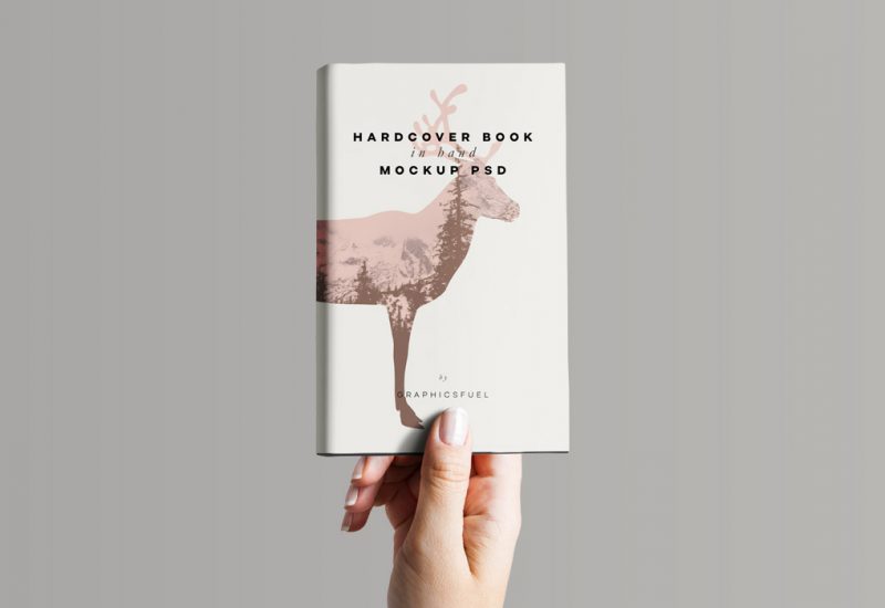 Hardcover Book In Hand Mockup