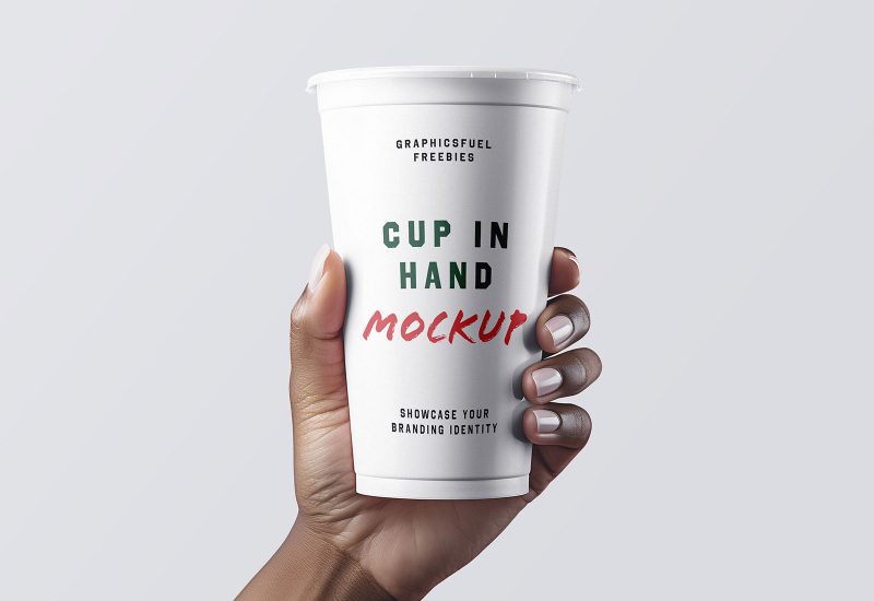 Coffee cup in hand mockup