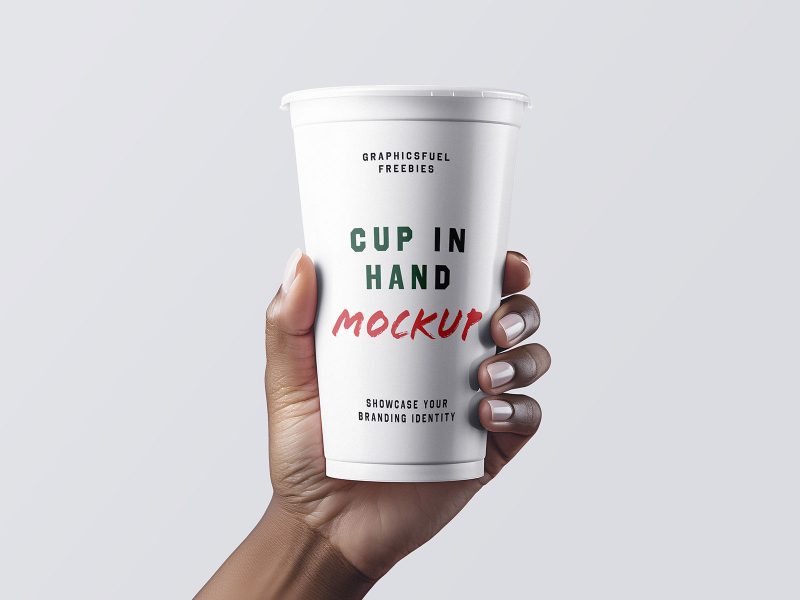 Coffee cup in hand mockup